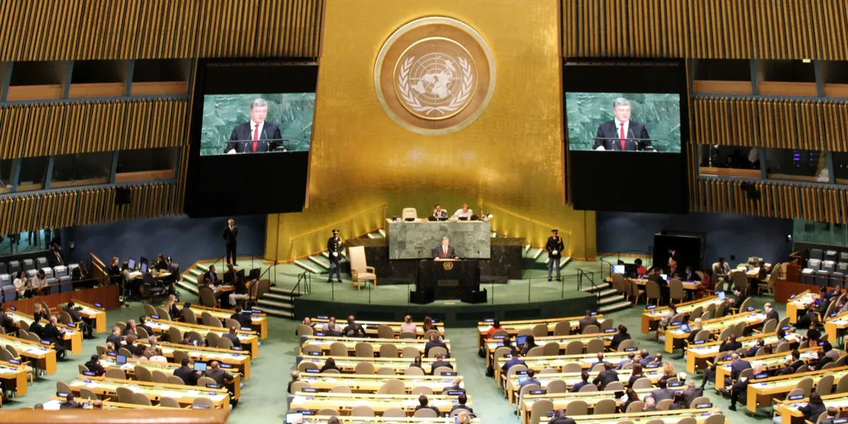 UN General Assembly meeting with speaker presenting.