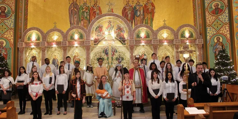 Church choir and clergy in ornate setting.