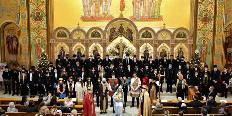 Church choir and nativity scene performance.